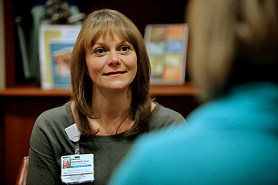 Amanda Hitchings, PsyD listens to a mother in recovery.