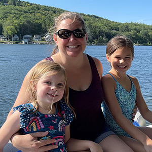 Ashley and her daughters on their boat