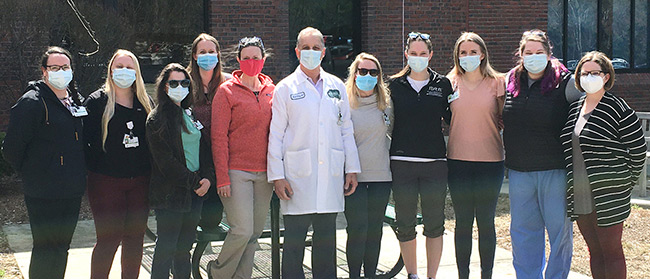 Mark Silbey, MD with Wanda Swiger, EdD, ATC, CES, NH-LAT and Cheshire Medical Center’s athletic trainers.