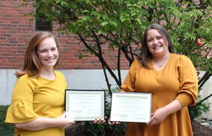 Monadnock Center for Violence Prevention (MCVP) Award Winners Kelsey Page and Lindsey Cushing stand outside Cheshire Medical Center with their awards.