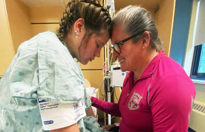 Kerry Kelly, volunteer with Cheshire Doulas, supporting her daughter, Kiara, during the birth of her first child.