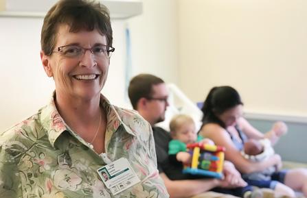 Doula with family after childbirth