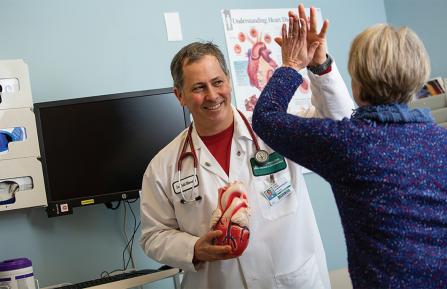 Doctor celebrates with patient