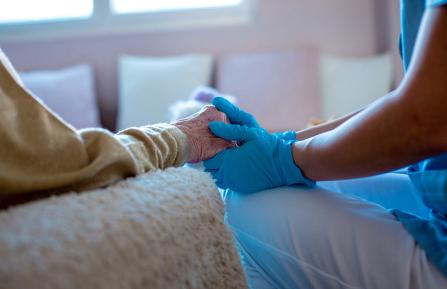 Provider holding patient's hands
