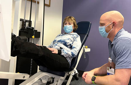Dave Luscombe, PT, with patient using equipment in Cheshire's Outpatient Rehab gym