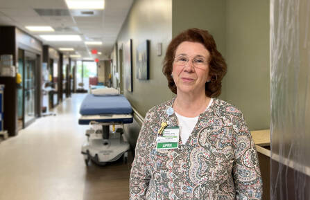 Sara Gilbert stands in the Emergency Department hallway