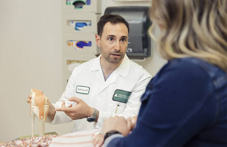 Neal Goldenberg, MD, MA, with a patient