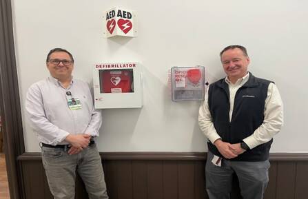 m left, John Letendre, continuum of care facilitator for Cheshire Medical Center’s Center for Population Health, and Steve Perrin, safety coordinator for Cheshire County, stand beside a NaloxBox opioid rescue kit.