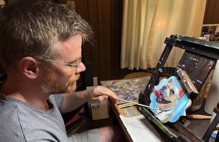Kenneth Toohey, supply chain receiving tech at Cheshire Medical Center, paints a dog
