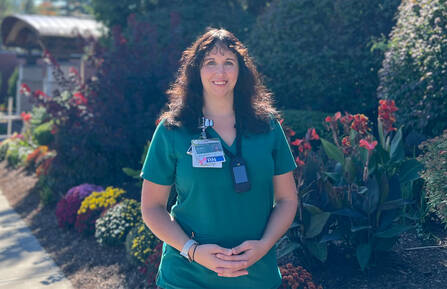 Sylvia Dunne, RN, BSN, poses for a photo outside of Cheshire Medical Center.
