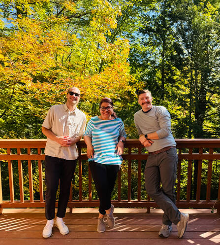 Three residents pose for a photo during the annual Residency Retreat