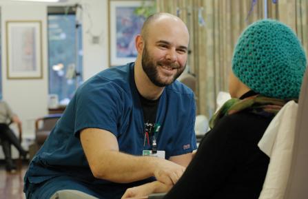 Oncology nurse with patient