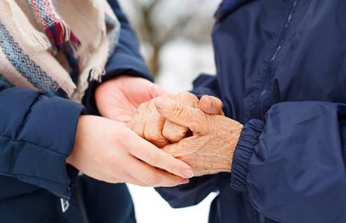 Two people holding hands