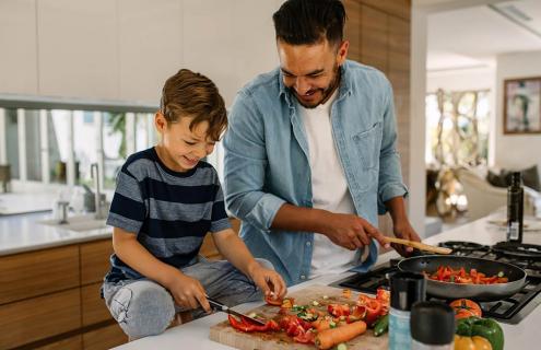 Father and son cooking together