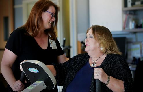 Claire Simpson shows off her strength as she reconnects with Occupational Therapist Cindi Zipoli.