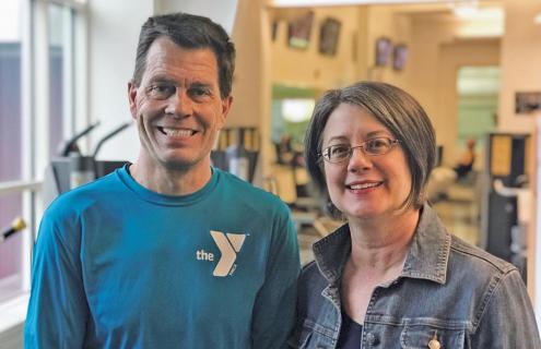Nurse with YMCA official in gym