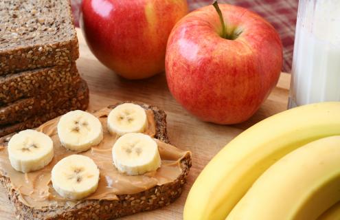 Peanut butter and banana sandwich with apples