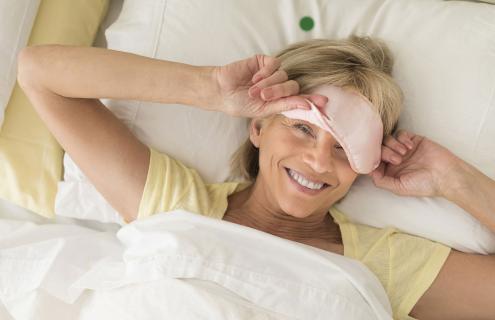 Woman waking up, smiling