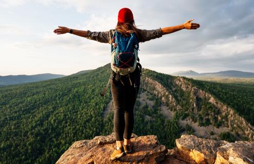 Hiker standing on mountain-top