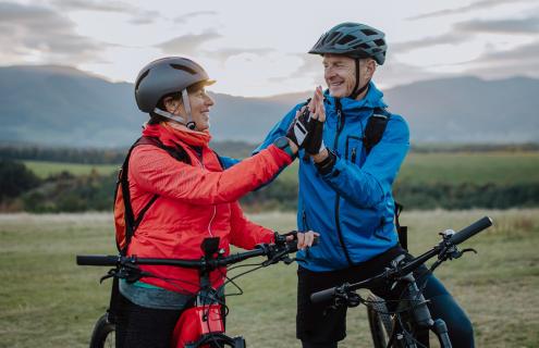 Healthy cyclists high five