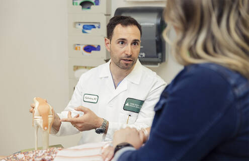 Neal Goldenberg, MD, MA, with a patient