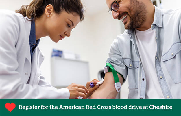Healthcare provider draws blood from a patient for the American Red Cross blood drive at Cheshire Medical Center