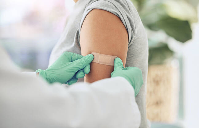 A person getting a bandage after a flu shot